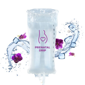 Prenatal Drip IV bag set against a background of anemone flowers, ice cubes and splashing water